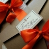 KĀZU UN JUBILEJU IELŪGUMI - ribbon celebrate 150x80 chocolate and orange